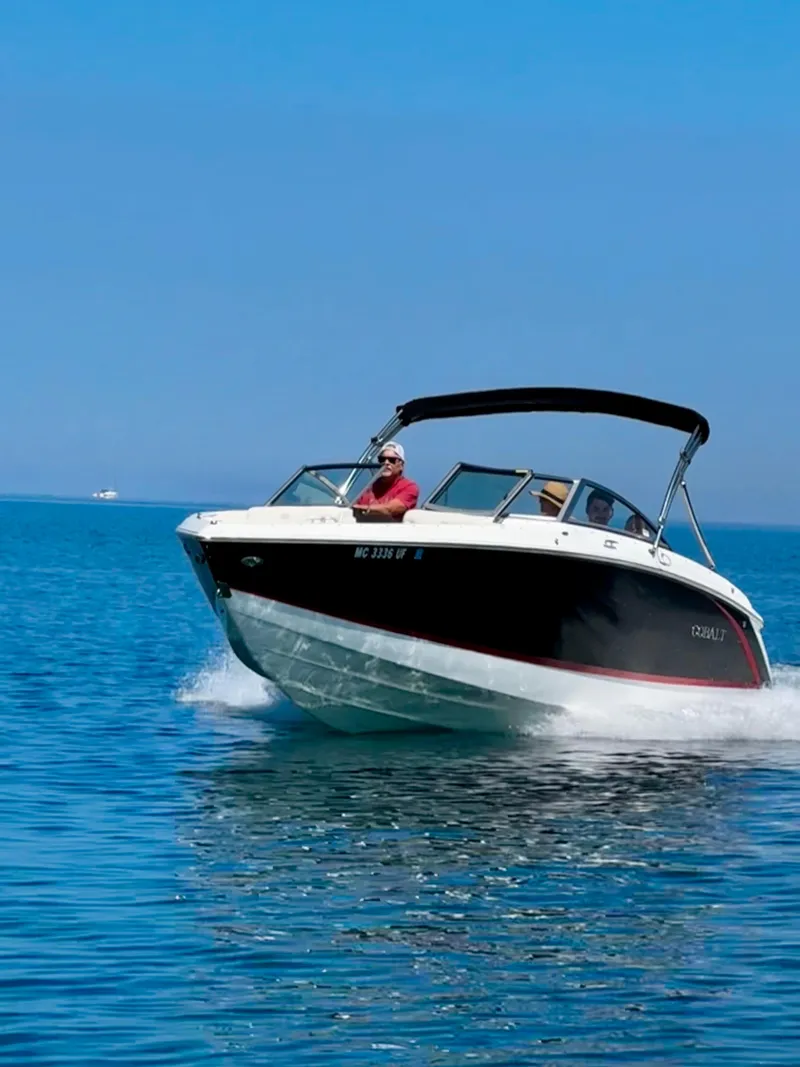 Slide: The Image of 2018 Cobalt R3 boat cruising on clear blue water under a sunny sky. - 7