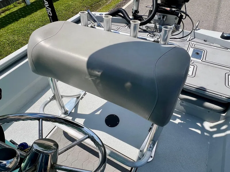 Slide: The Image of 2022 Avid 21 FS boat helm with gray seat and rod holders. - 10