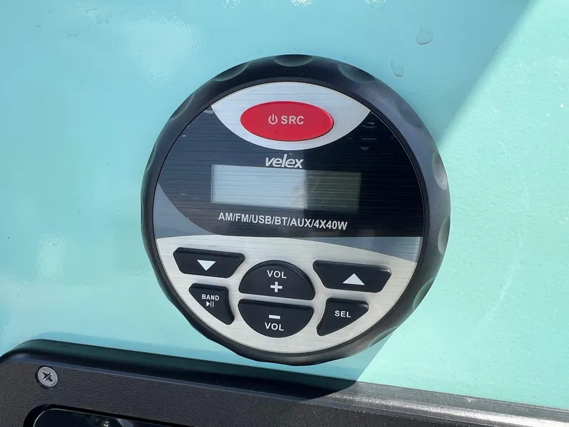 Slide: The Image of Velex audio system on 2022 Avid 21 FS boat dashboard. - 18