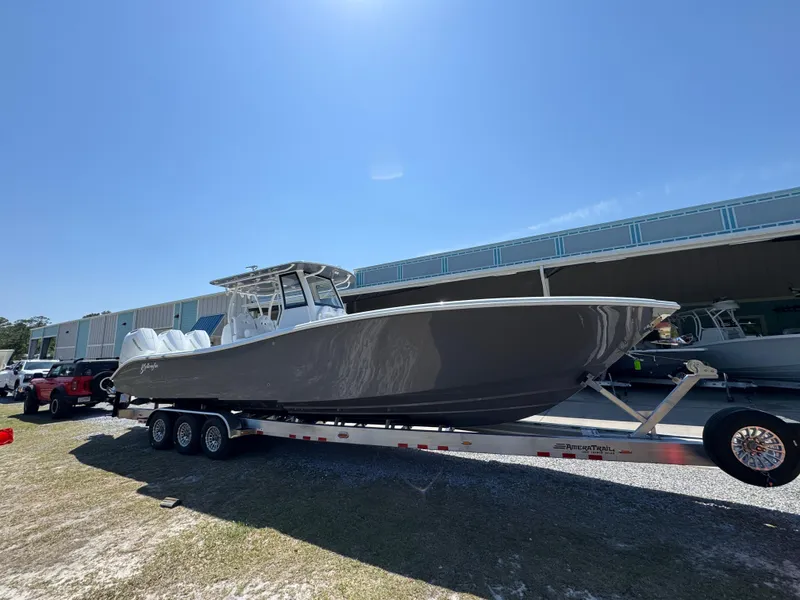 Slide: The Image of 2025 Yellowfin 36 Offshore boat on trailer under clear blue sky. - 3