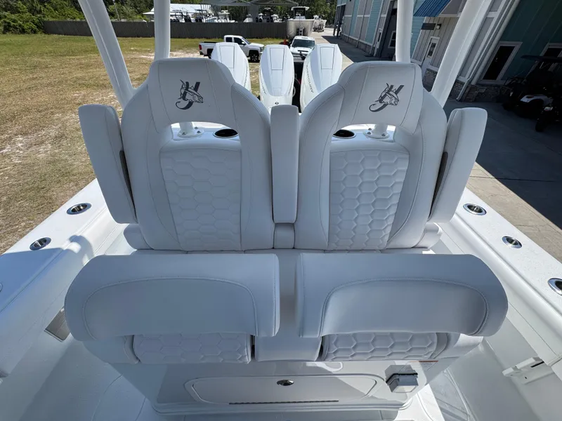 Slide: The Image of 2025 Yellowfin 36 Offshore boat with white cushioned seats and sleek design. - 35