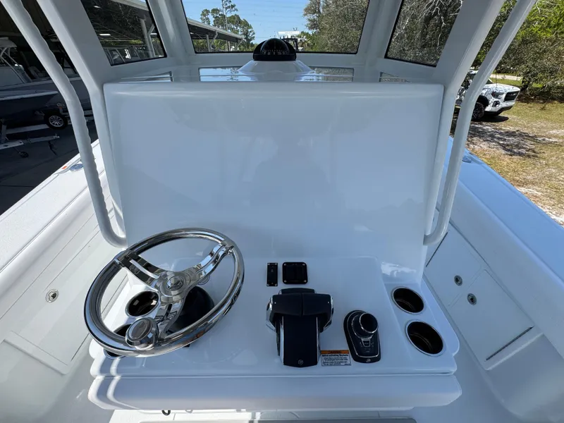 Slide: The Image of 2025 Yellowfin 36 Offshore boat helm with steering wheel and controls. - 37