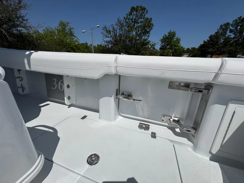 Slide: The Image of 2025 Yellowfin 36 Offshore boat interior with white seating and hardware details. - 43