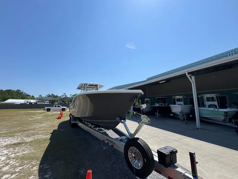 Slide: The Image of 2025 Yellowfin 36 Offshore boat on trailer under clear blue sky. - 6