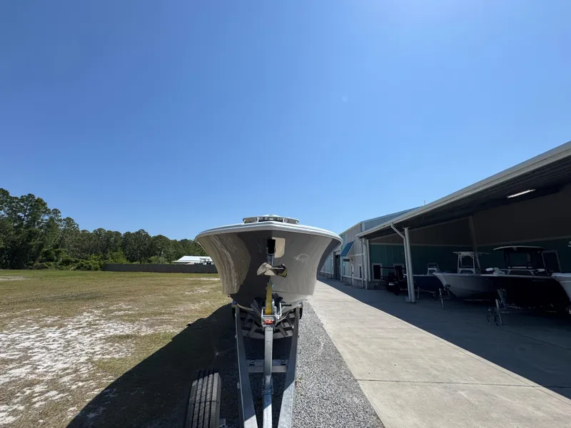 Slide: The Image of 2025 Yellowfin 36 Offshore boat on trailer under clear blue sky. - 7