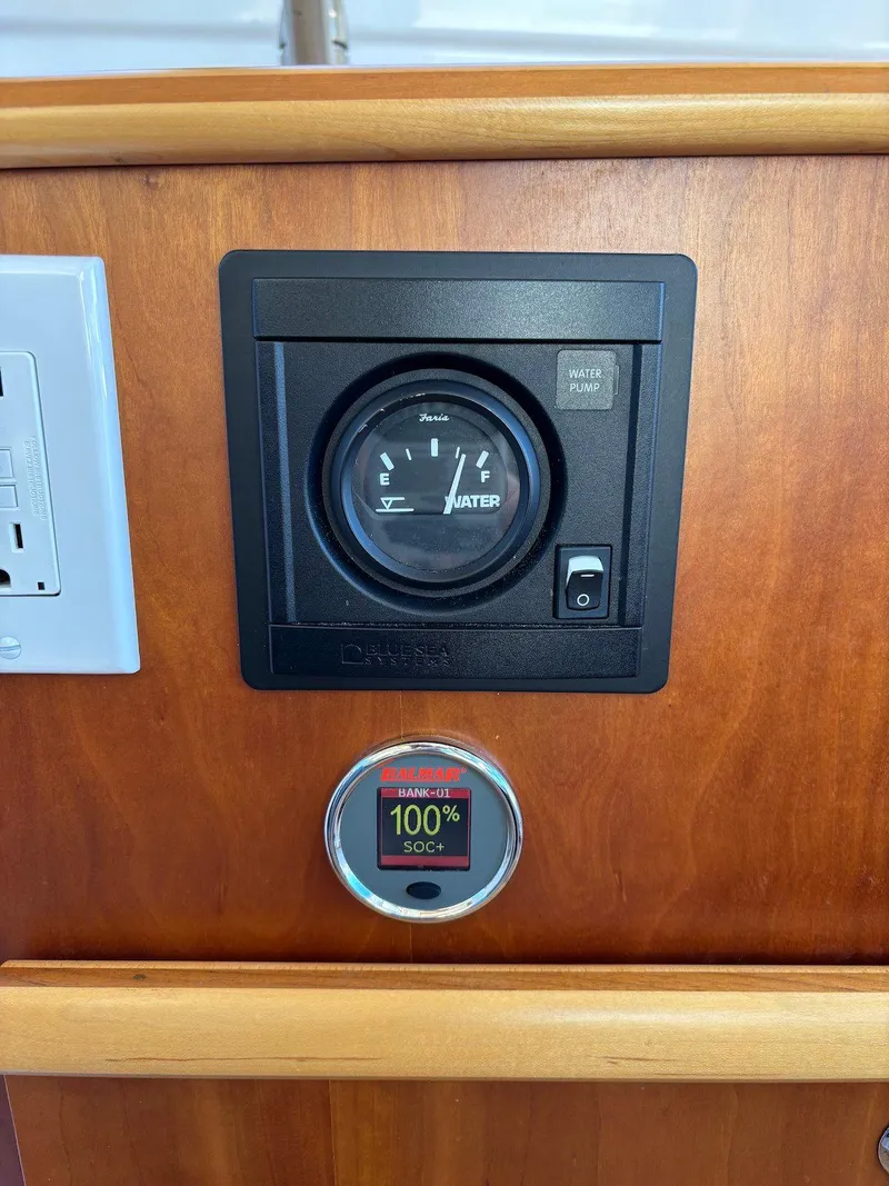 Slide: The Image of 2019 Cutwater C-242 Coupe dashboard with water gauge and battery indicator. - 15