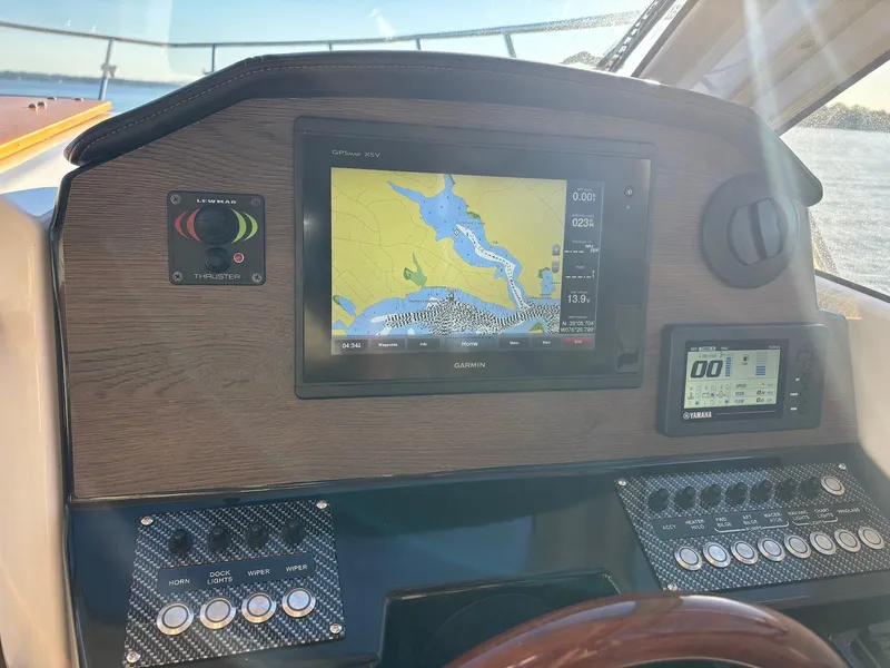 Slide: The Image of 2019 Cutwater C-242 Coupe dashboard with navigation display and control panel. - 7