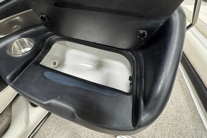 Slide: The Image of Open storage compartment in 2006 Crownline 21 Classic boat interior. - 12