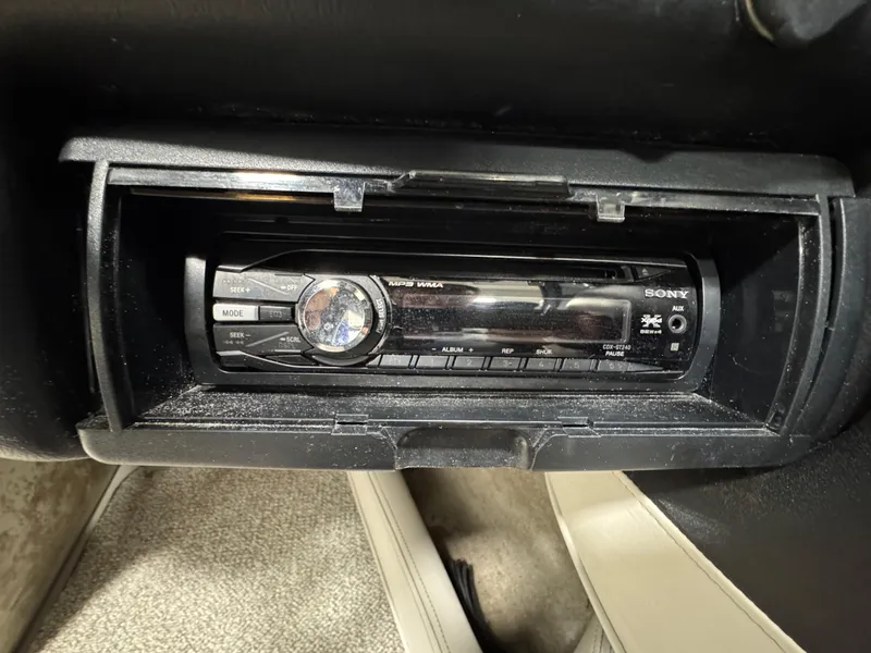 Slide: The Image of Sony car stereo installed in a 2006 Crownline 21 Classic boat dashboard. - 16