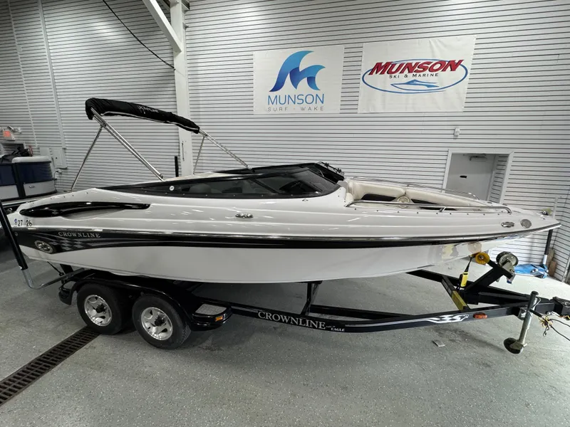 Slide: The Image of 2006 Crownline 21 Classic boat on trailer in showroom with Munson signage. - 4