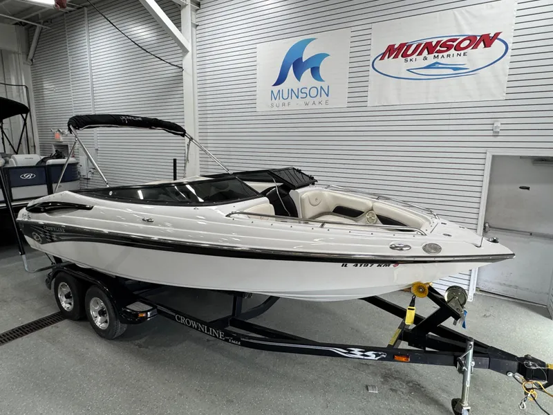 Slide: The Image of 2006 Crownline 21 Classic boat on trailer in showroom with Munson signage. - 5