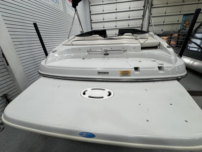 Slide: The Image of 2006 Crownline 21 Classic boat, rear view in a showroom setting. - 6