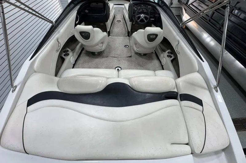 Slide: The Image of 2006 Crownline 21 Classic boat interior with white seating and steering console. - 7