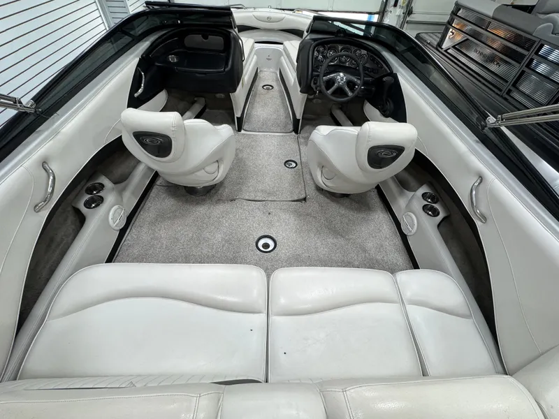 Slide: The Image of 2006 Crownline 21 Classic boat interior with white seating and steering console. - 8