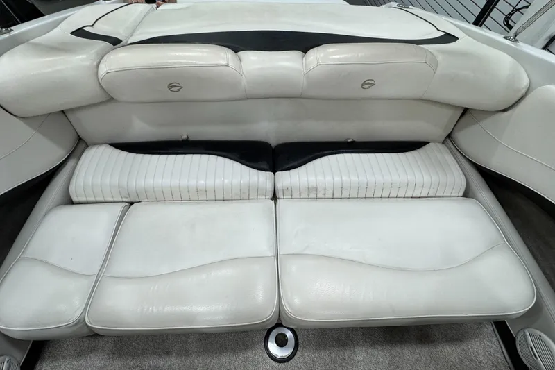 Slide: The Image of 2006 Crownline 21 Classic boat interior with white cushioned seating. - 9