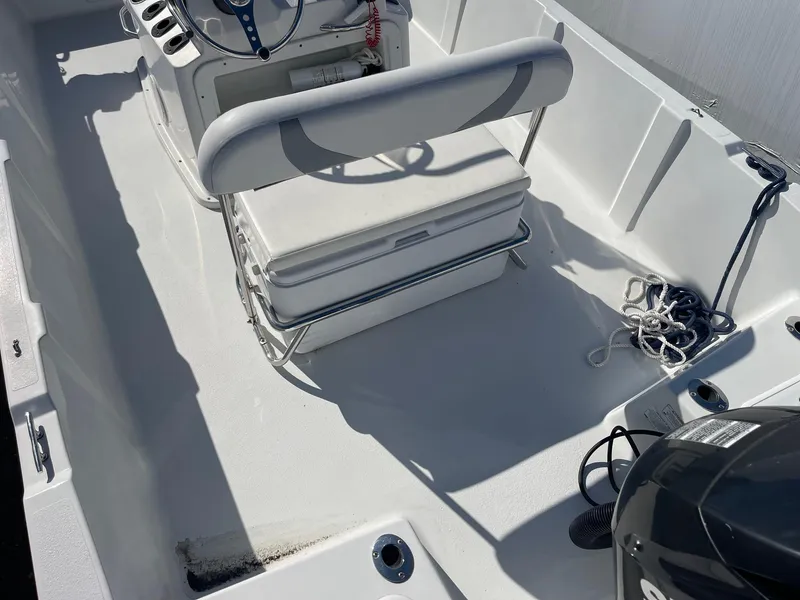 Slide: The Image of 2011 Carolina Cat 18CC boat interior with seating and steering console. - 12