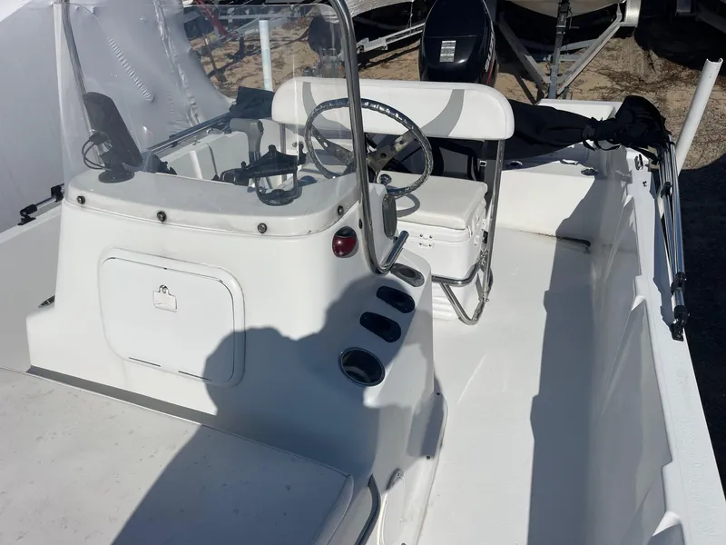 Slide: The Image of 2011 Carolina Cat 18CC boat interior with steering console and seating. - 13