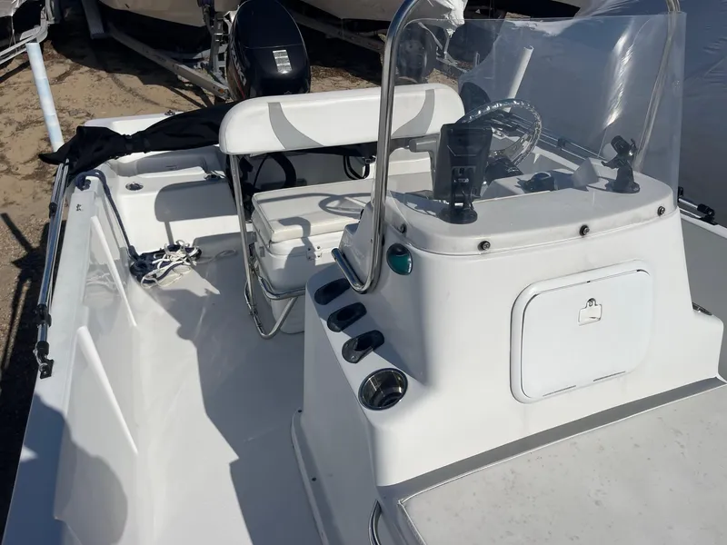 Slide: The Image of 2011 Carolina Cat 18CC boat interior with steering console and seating. - 14