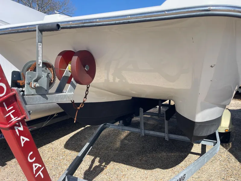 Slide: The Image of 2011 Carolina Cat 18CC boat on trailer, side view, outdoors. - 3