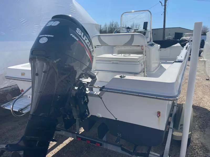 Slide: The Image of 2011 Carolina Cat 18CC boat with Suzuki outboard motor on trailer. - 6
