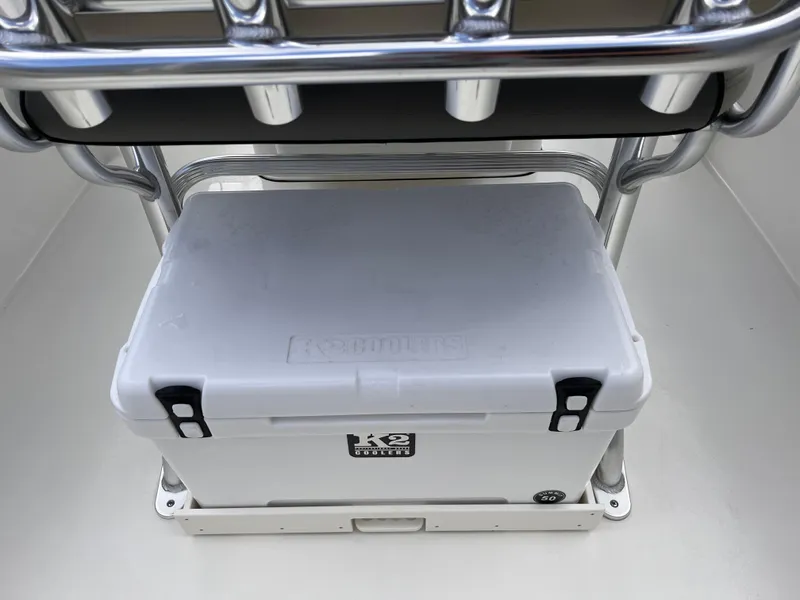Slide: The Image of 2025 Key West 203 FS boat with a secured white cooler under the seat. - 13