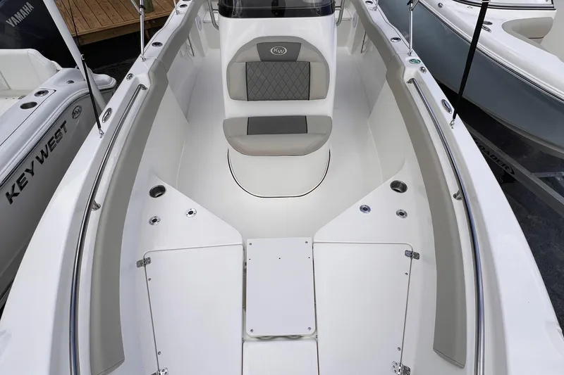 Slide: The Image of 2025 Key West 203 FS boat interior with seating and storage compartments. - 15