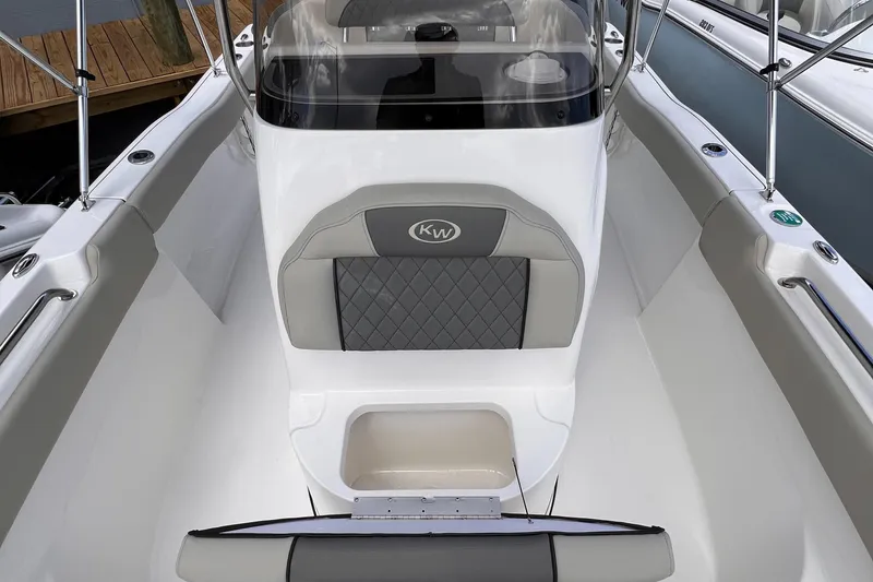 Slide: The Image of 2025 Key West 203 FS boat interior with cushioned seating and sleek design. - 18
