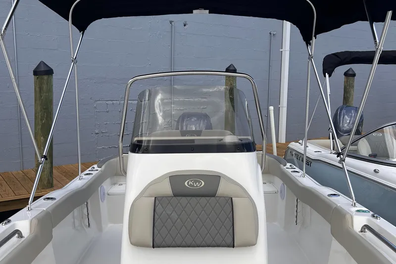 Slide: The Image of 2025 Key West 203 FS boat with canopy and sleek interior design. - 25