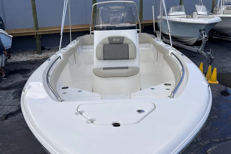 Slide: The Image of 2025 Key West 203 FS boat with sleek design and spacious seating. - 8