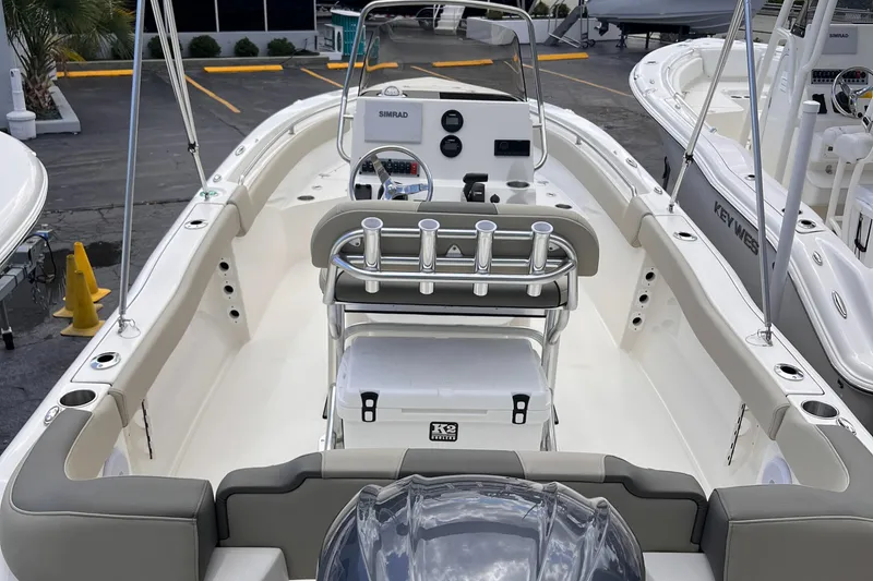 Slide: The Image of 2025 Key West 203 FS boat interior with steering console and seating. - 9
