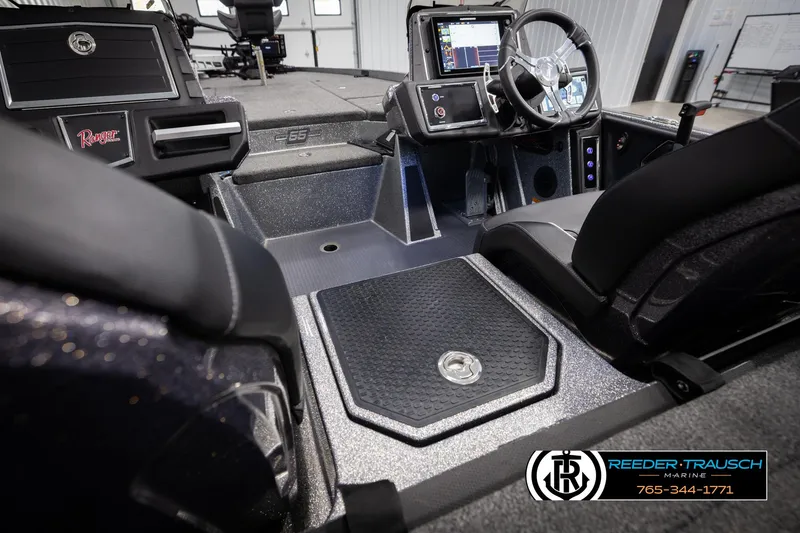 Slide: The Image of 2023 Ranger Z 521R boat interior with steering wheel and control panel. - 19