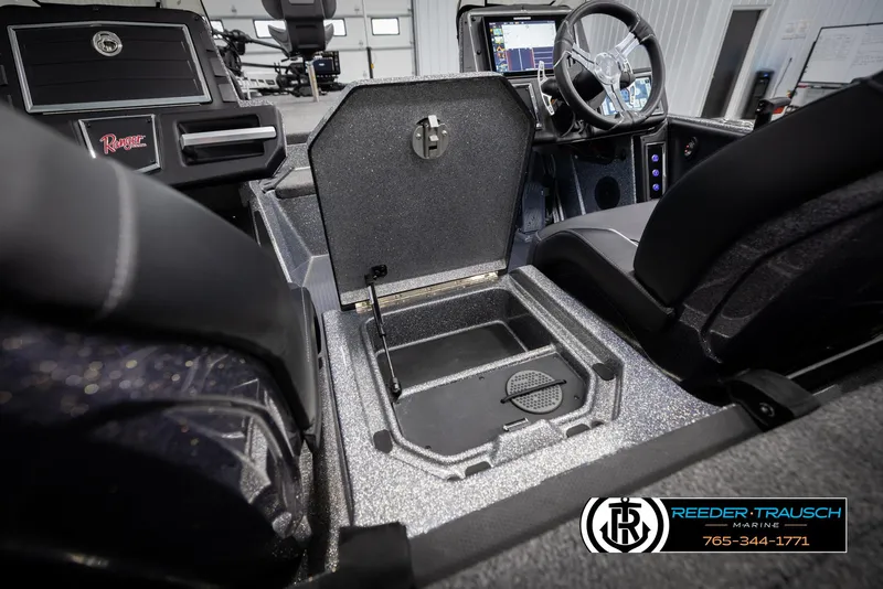 Slide: The Image of 2023 Ranger Z 521R boat interior with open storage compartment and steering wheel. - 20