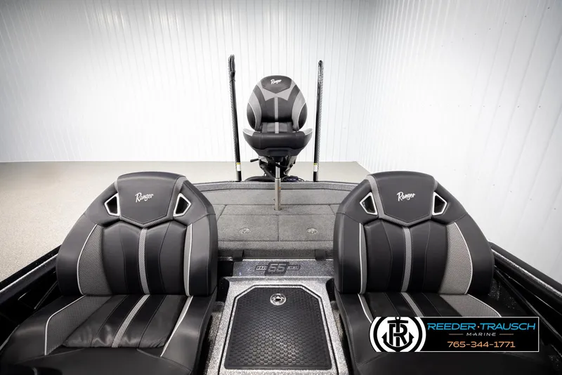 Slide: The Image of 2023 Ranger Z 521R boat interior with black and gray seats, Reeder Trausch Marine logo. - 21