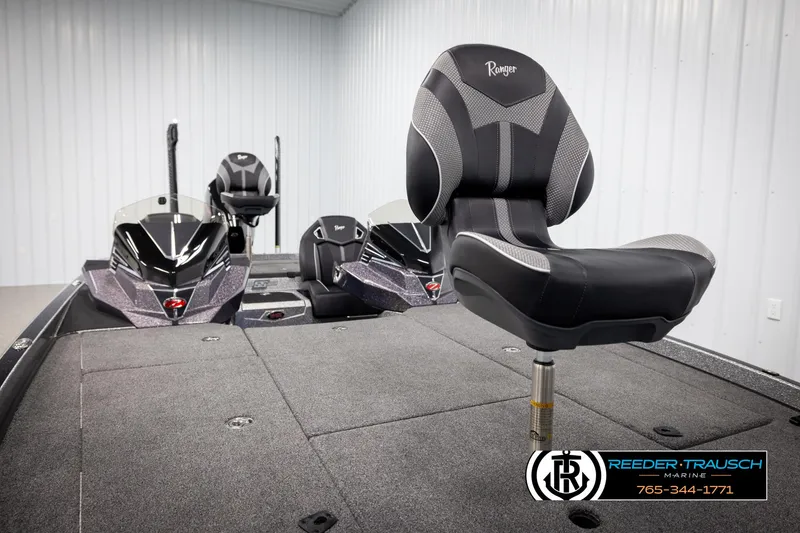 Slide: The Image of 2023 Ranger Z 521R boat interior with seating and control panel in showroom. - 27