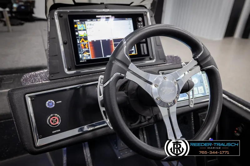 Slide: The Image of 2023 Ranger Z 521R boat dashboard with steering wheel and digital display. - 30