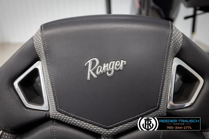 Slide: The Image of 2023 Ranger Z 521R boat seat with logo, featuring sleek black and gray design. - 44
