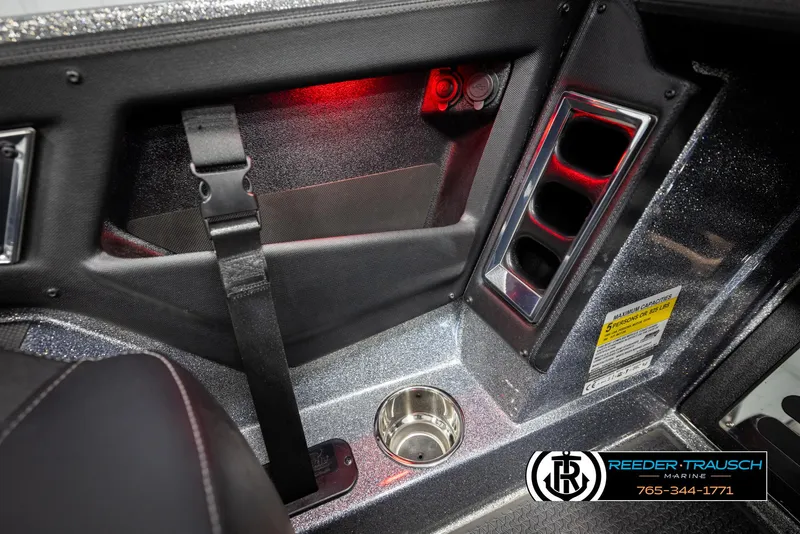 Slide: The Image of Interior of 2023 Ranger Z 521R boat with cup holder and red lighting. - 46