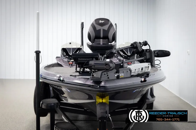 Slide: The Image of 2023 Ranger Z 521R fishing boat with advanced equipment in showroom setting. - 7