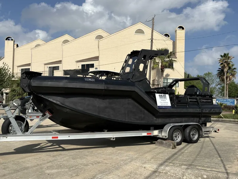 The Image of 2023 DGS 22 Monster boat on trailer, parked outdoors near industrial buildings. - 1