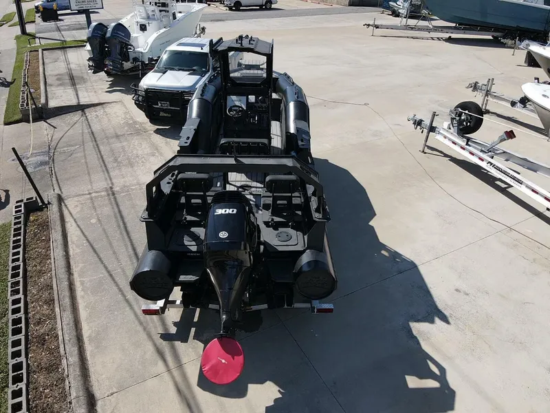 Slide: The Image of 2023 DGS 22 Monster boat with powerful engine, parked on concrete lot. - 6