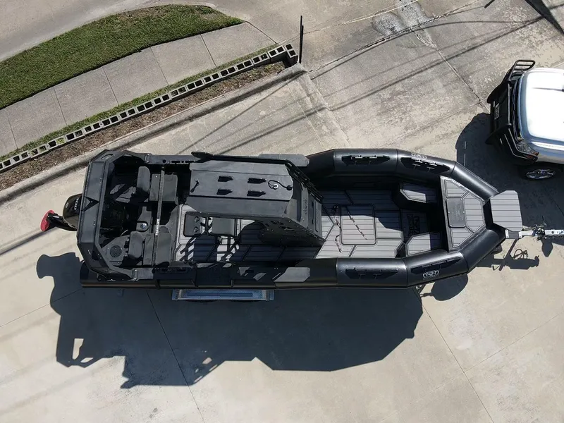 Slide: The Image of Aerial view of 2023 DGS 22 Monster boat on trailer, parked on concrete. - 7