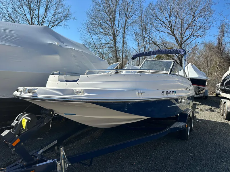 Slide: The Image of 2007 Smoker Craft Vectra 2042 OB boat on trailer, parked outdoors. - 1