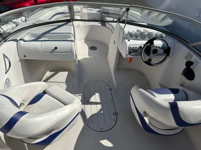 Slide: The Image of 2007 Smoker Craft Vectra 2042 OB boat interior with steering wheel and seating. - 11