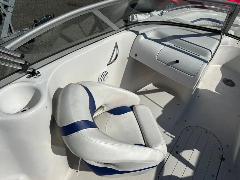 Slide: The Image of 2007 Smoker Craft Vectra 2042 OB boat interior with white and blue seating. - 12