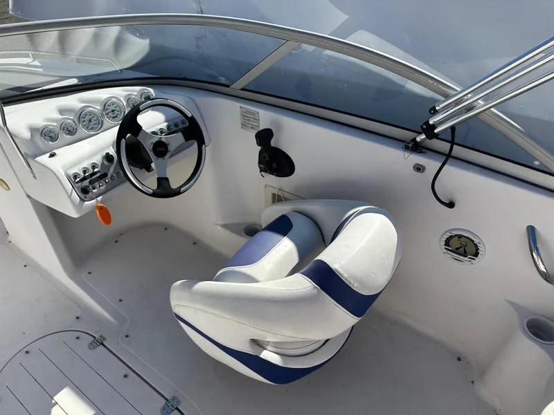 Slide: The Image of 2007 Smoker Craft Vectra 2042 OB boat cockpit with steering wheel and gauges. - 13