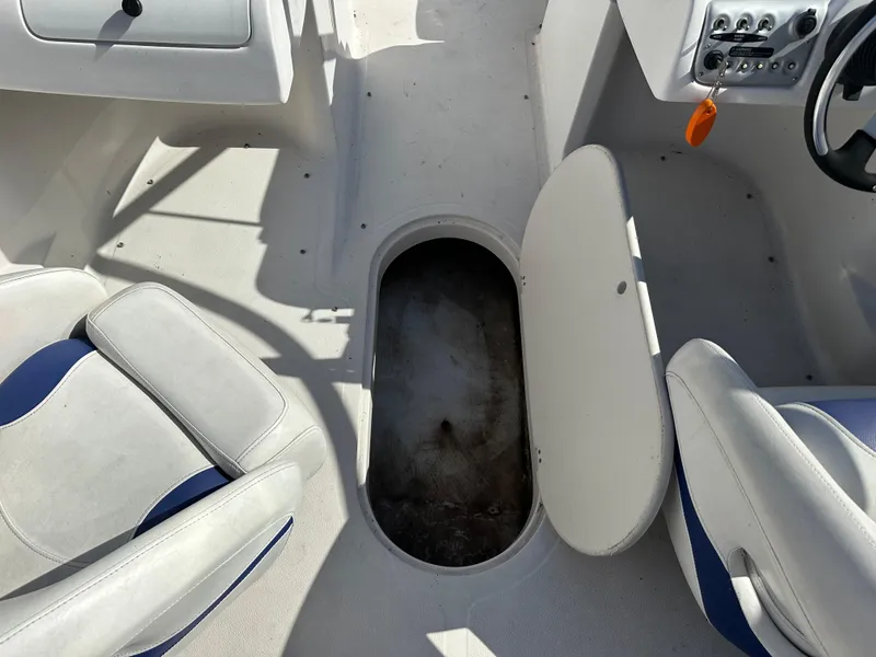 Slide: The Image of 2007 Smoker Craft Vectra 2042 OB boat interior with open storage compartment. - 15