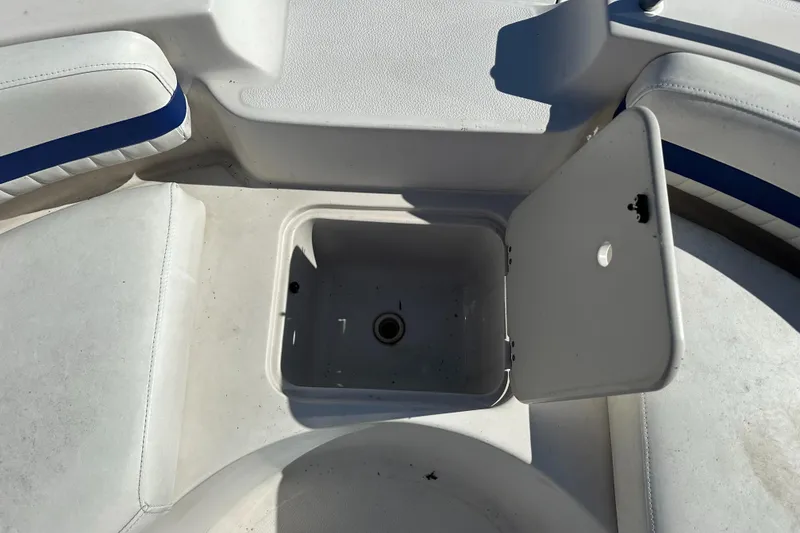 Slide: The Image of Open storage compartment on 2007 Smoker Craft Vectra 2042 OB boat. - 19