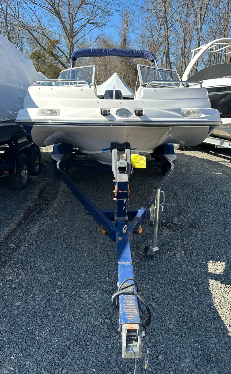 Slide: The Image of 2007 Smoker Craft Vectra 2042 OB boat on trailer, parked outdoors. - 2