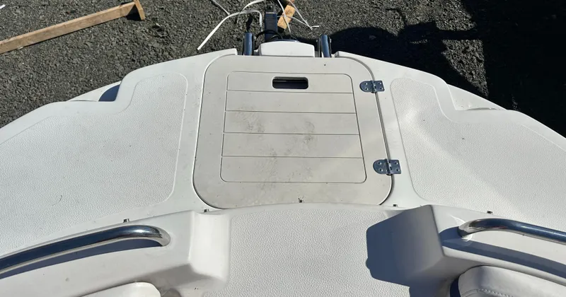 Slide: The Image of 2007 Smoker Craft Vectra 2042 OB boat deck with storage hatch and railing. - 20