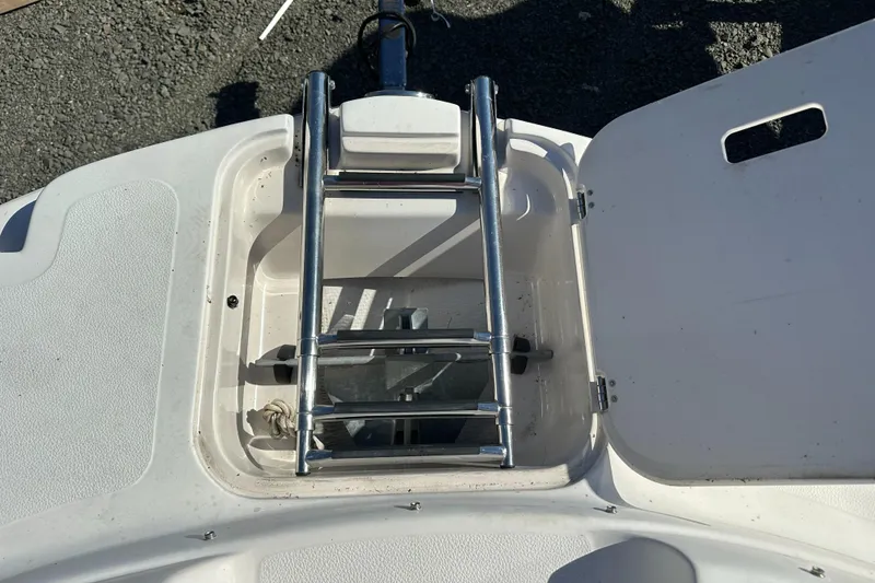 Slide: The Image of 2007 Smoker Craft Vectra 2042 OB boat ladder and storage compartment. - 21